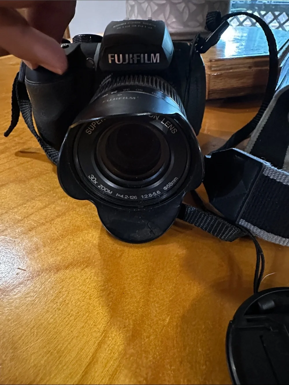 Fujifilm Black Camera Body with Black Lens and Red Trim